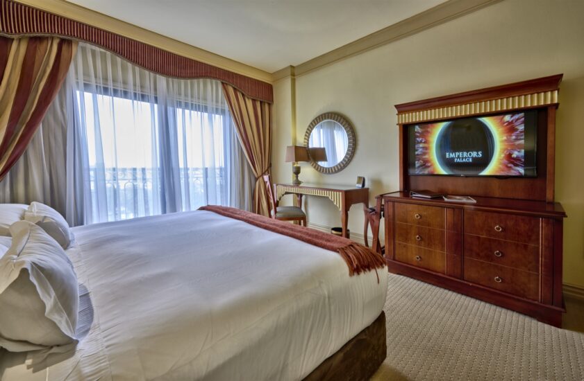 Special Assistance room with bed, TV and dresser at the D'oreale Grande