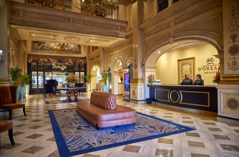 Hotel lobby with reception desk and leather daybed at the D'oreale Grande, Emperors Palace