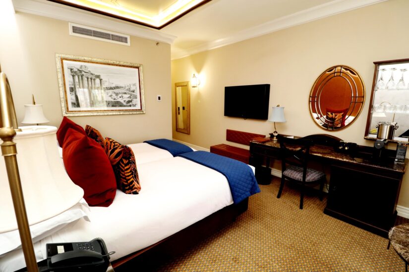 Deluxe room with wall TV and desk at the D'oreale Grande