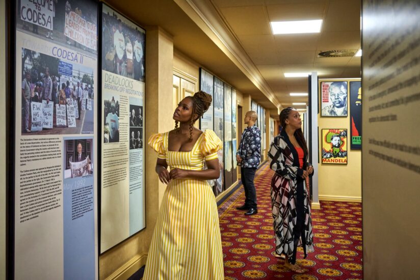Guests viewing historical CODESA and Mandela displays along a hotel corridor at Emperors Palace
