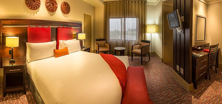 Presidential Suite bedroom with window view at Peermont Mondior